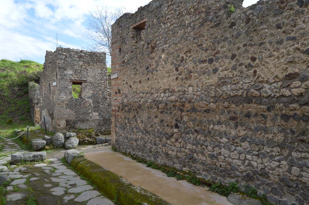 Vicolo del Centenario, west side, Pompeii. March 2018. 
Looking south along west side towards junction with Unnamed Vicolo between IX.5 and IX.6, centre left. 
Foto Taylor Lauritsen, ERC Grant 681269 DÉCOR.
