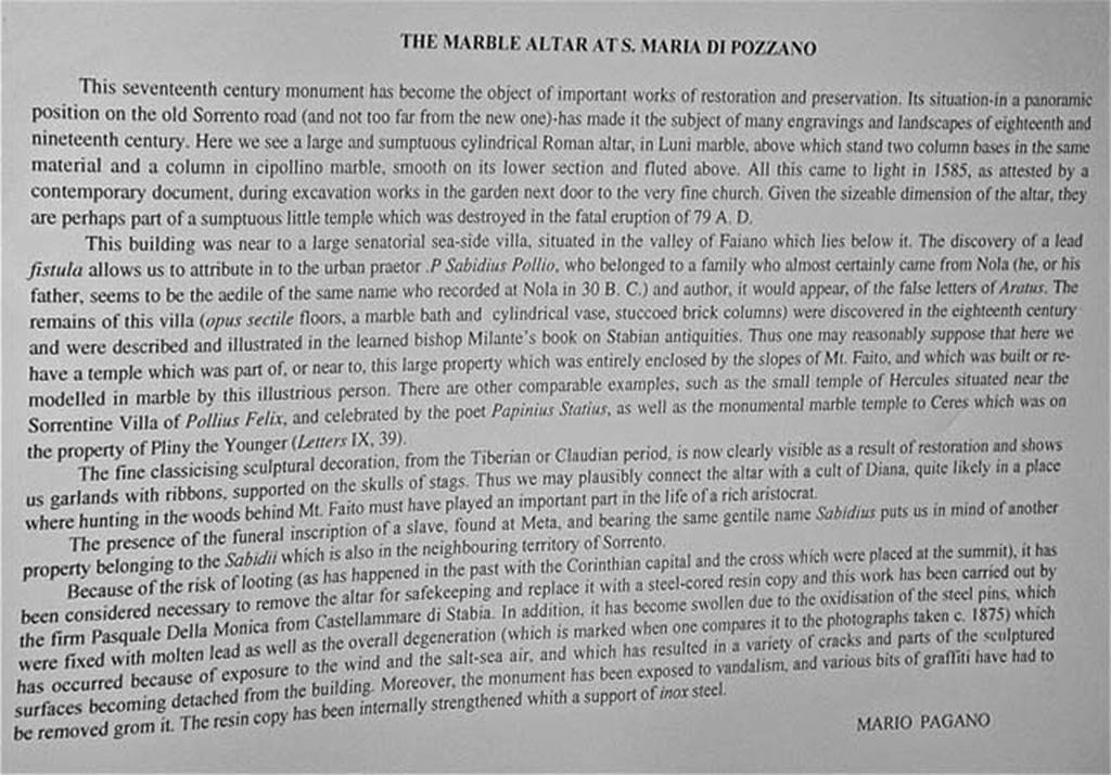 Stabiae Temple of Diana. April 2005. Description card in the Villa San Marco by Mario Pagano, about the decorated marble altar.
It was found in 1585 during excavation works in the garden next to the church of S. Maria di Pozzano. 
It may have been part of a small temple, probably to Diana, which was destroyed by the eruption of 79AD.
Photo courtesy of Michael Binns.
