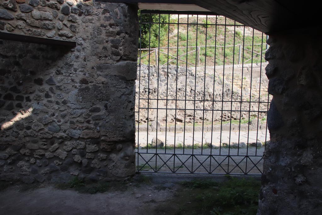 HGW25 Pompeii. Part of Villa of Diomedes. October 2023. Looking towards east wall with “wagons/carts entrance”. Photo courtesy of Klaus Heese.