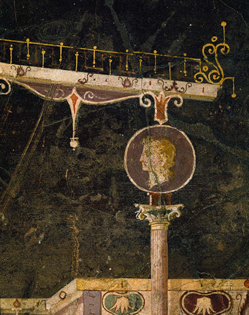 Villa of Agrippa Postumus Boscotrecase. Black room. Detail from east end of aedicula on north wall. 
This portrait medallion also has a purple background which was reserved for imperial subjects in this period.
© Metropolitan Museum New York. Rogers Fund, 1920. Inventory number 20.192.1.
See Anderson, M. L., 1988. The Imperial Villa at Boscotrecase in Metropolitan Museum Bulletin, 1988, p. 54 no 57.
