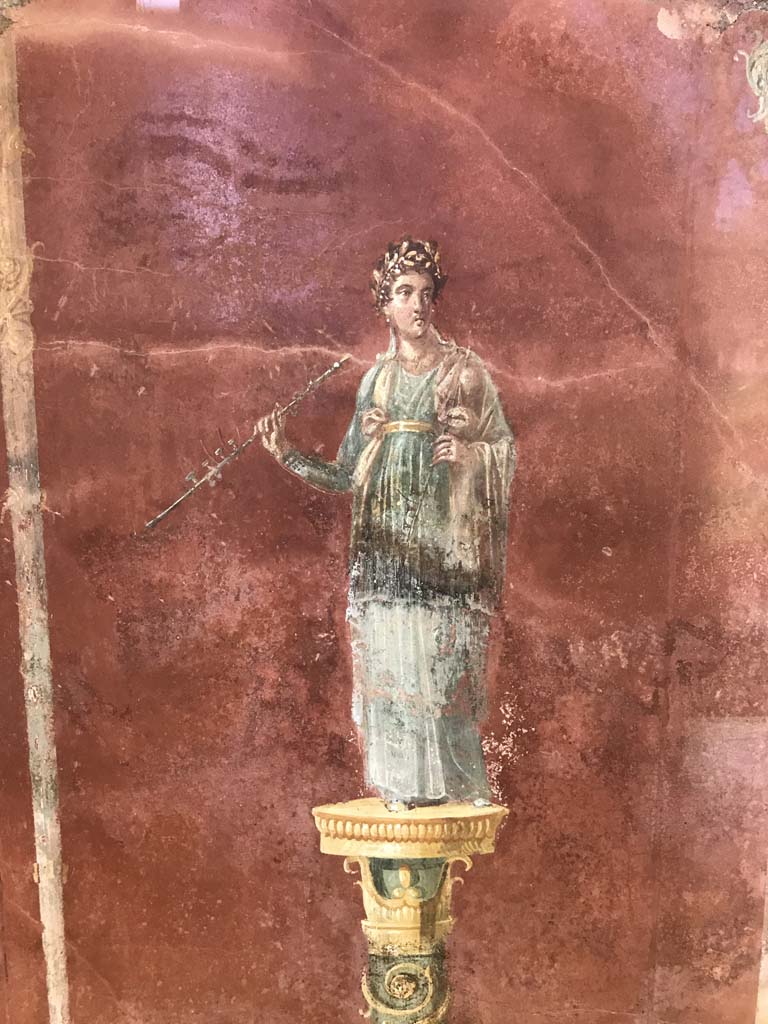 Complesso dei triclini in località Moregine a Pompei. April 2019. Triclinium A, north wall.
Euterpe the muse of flutes and music with a double flute.
Photo courtesy of Rick Bauer.

