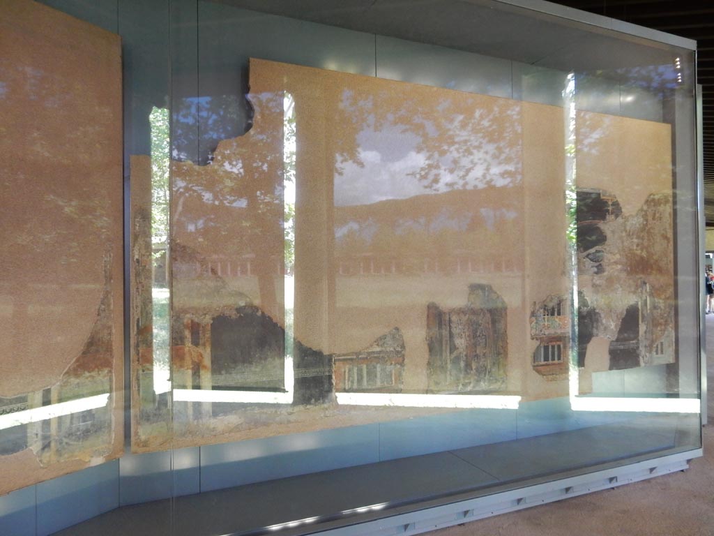 Complesso dei triclini in località Moregine a Pompei. May 2018. Triclinium B, east wall, on display in the Pompeii Palaestra.
In the bottom centre is the painting of the second of the Dioscuri.
Photo courtesy of Buzz Ferebee.
