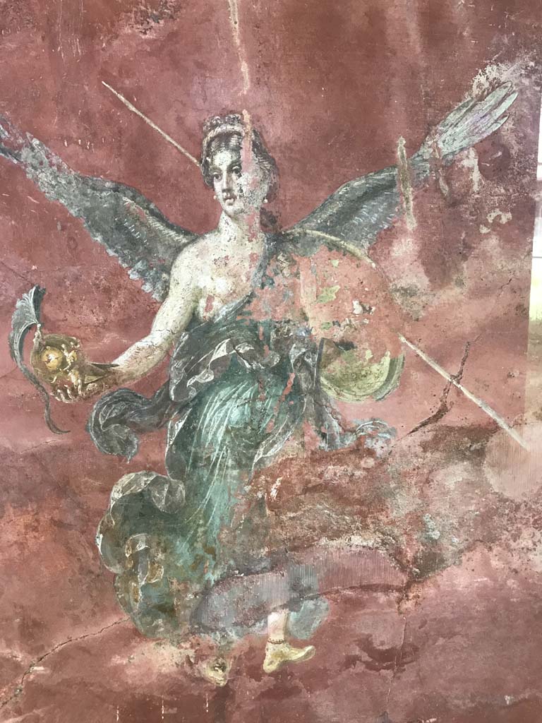 Complesso dei triclini in località Moregine a Pompei. April 2019. Triclinium C, west wall. 
Winged Victory with the attributes of Athena.
Photo courtesy of Rick Bauer.
