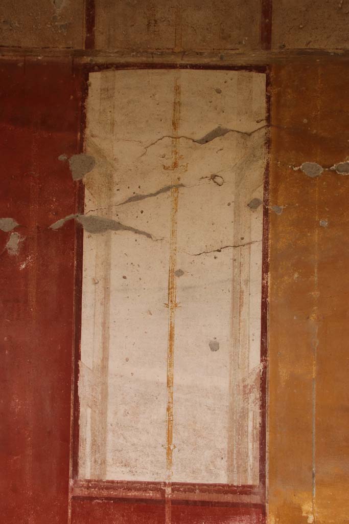 Oplontis Villa of Poppea, October 2020. 
East Portico 34, detail of golden candelabra on white painted panel. Photo courtesy of Klaus Heese.
