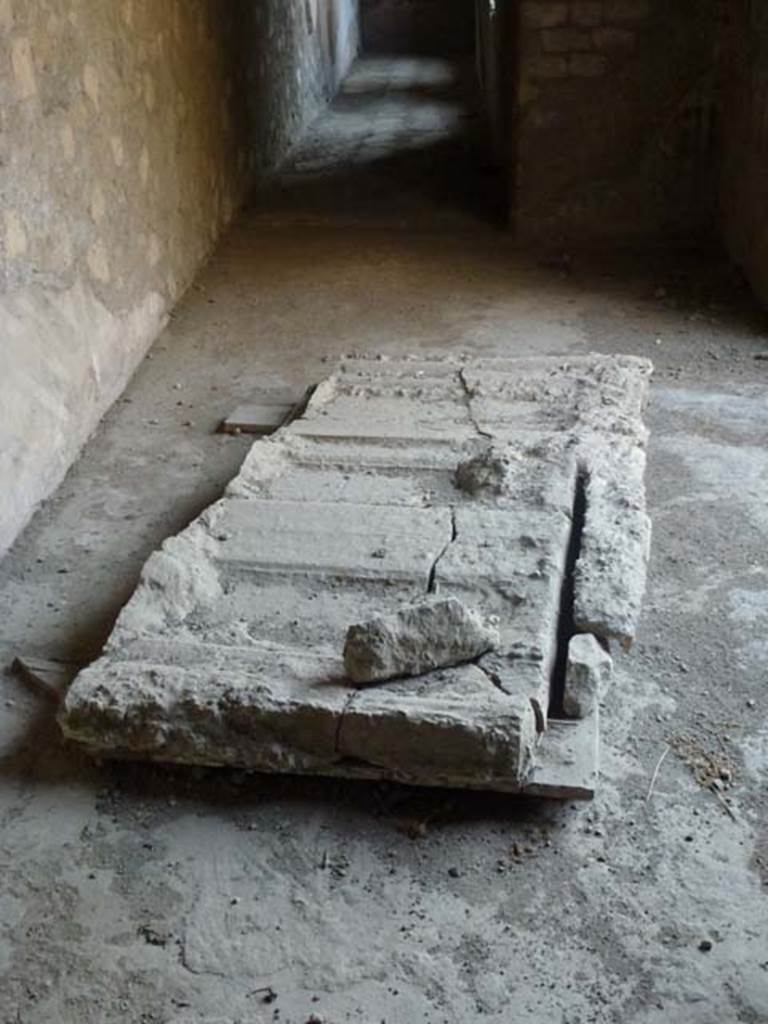 Oplontis, September 2011. Corridor 62, with plaster-cast of door/shutter. Looking west. Photo courtesy of Michael Binns.