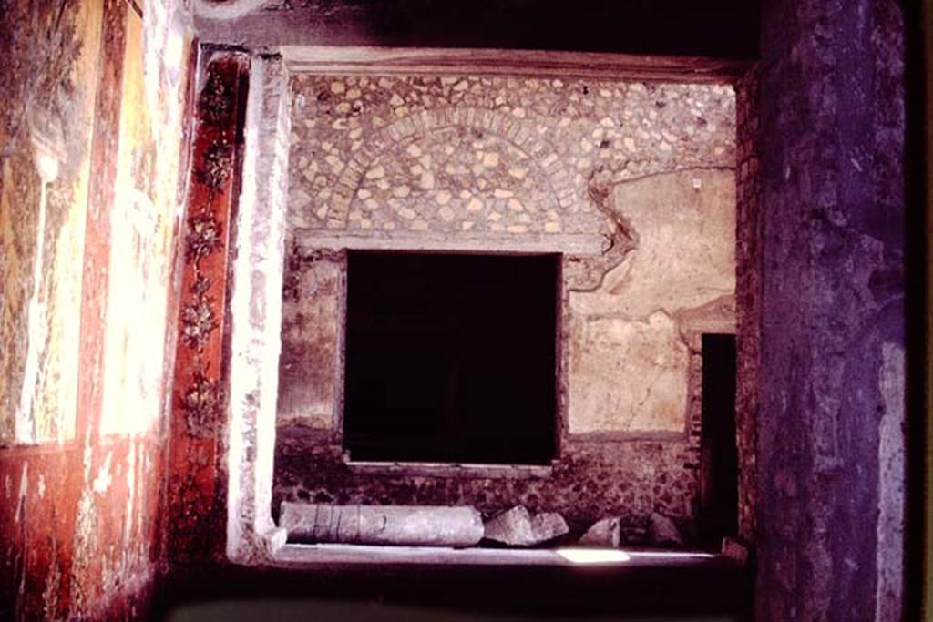 Oplontis, 1978. Room 70, south wall with window overlooking room 69, to window of room 68, and doorway to room 67. Photo by Stanley A. Jashemski.   
Source: The Wilhelmina and Stanley A. Jashemski archive in the University of Maryland Library, Special Collections (See collection page) and made available under the Creative Commons Attribution-Non Commercial License v.4. See Licence and use details. J78f0628
