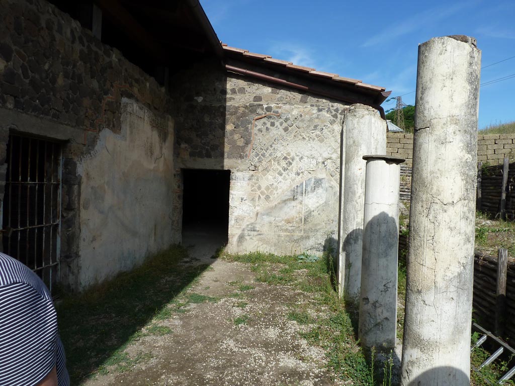 Stabiae, Villa Arianna, September 2015. Doorways to rooms in north-east corner of portico, looking east across porticoed courtyard W.22.
