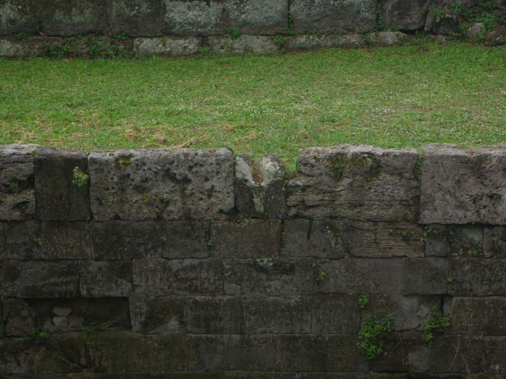 Walls on north side of Pompeii. May 2010. Detail from wall on east side of Tower XI. Photo courtesy of Ivo van der Graaff.