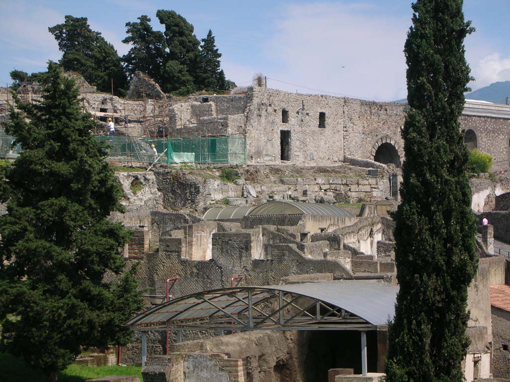 Walls on west side of Pompeii. May 2010. 
Looking south-east towards City Walls (across centre), with rooms 44/45 of VI.16.13 (in centre) and Marine Gate, left of tree. 
Photo courtesy of Ivo van der Graaff.
