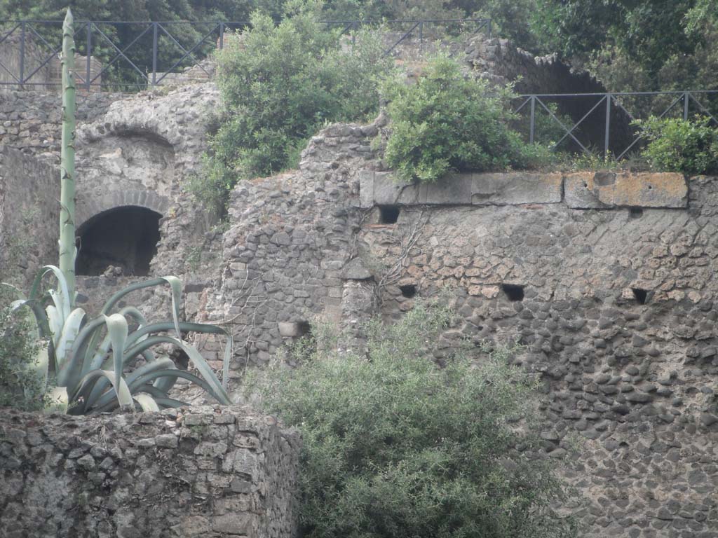 VIII.2.39 on left, and rear of Triangular Forum, on right, Pompeii. May 2011. Looking north. Photo courtesy of Ivo van der Graaff.